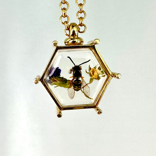 Hornet with a Purple Flower and a Yellow Bud